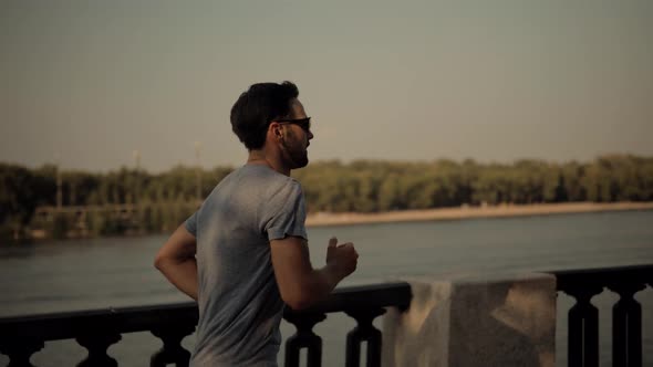 Triathlete Running,Sprinting And Endurance Workout Training.Marathon Runner Jog On Park.Running Man alt