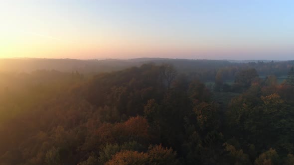 Aerial View of Foggy Landscape at Sunrise
