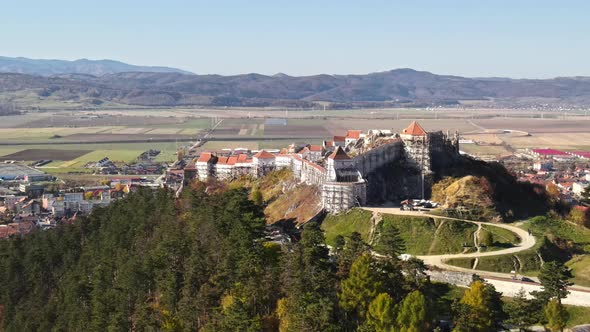 Aerial drone view of The Rasnov Fortress in Romania. Medieval fortress on the top of the hill, villa alt