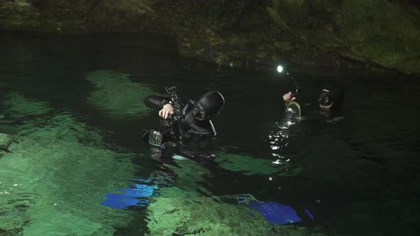 Scuba Divers Photographers in the Cenote Lake