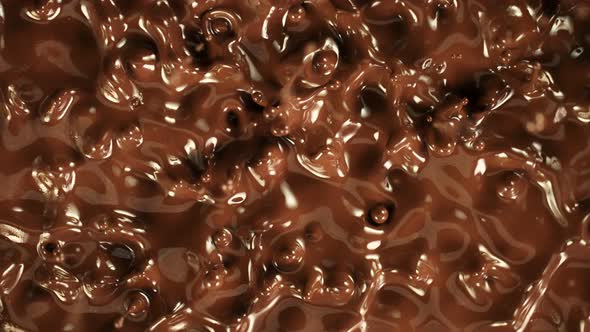 Super Slow Motion Detail Shot of Splashing Melted Chocolate at 1000 Fps alt