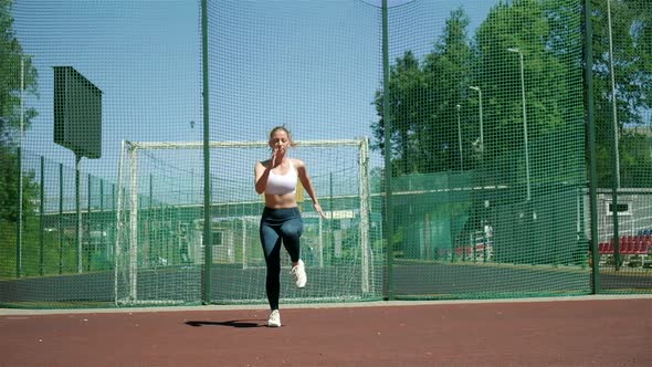 Caucasian Sportive Blond Busty Pretty Female Spot Running Sprinting in Place alt