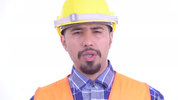 Face of Serious Bearded Persian Man Construction Worker Nodding Head No alt