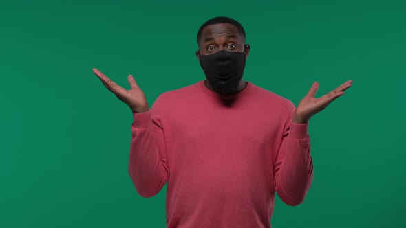Health Pandemic and Safety Concept African American Young Man Wearing Face Protective Medical Mask alt
