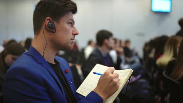 Auditorium Crowd Business People Write Notepad Pen. Viewer Forum Listen Speaker alt