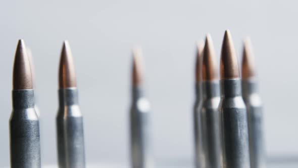 Cinematic rotating shot of bullets on a metallic surface - BULLETS 021 alt