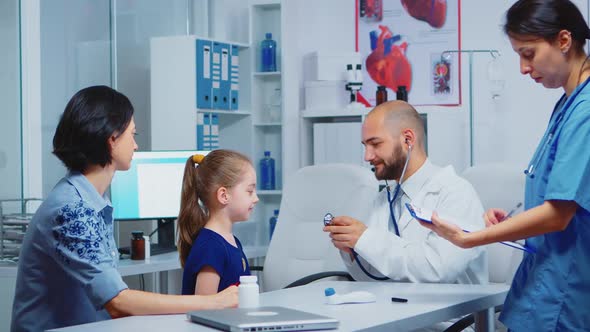 Doctor Examining Child in Hospital alt