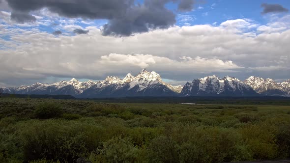 Zooming in towards the Grand Teton Mountains when snow capped alt