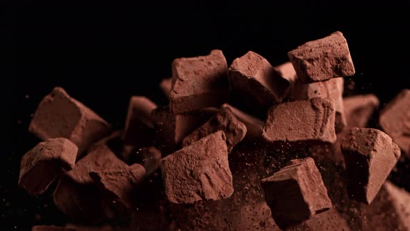 Super Slow Motion Shot of Raw Chocolate Chunks and Cocoa Powder After Being Exploded at 1000Fps alt
