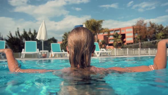 Relaxing Leisure In Swimming Pool On Resort.Having Fun On Swimming Pool Summer Vacation Holiday Trip alt