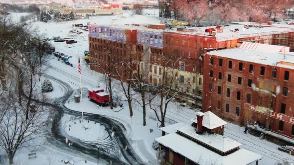 AERIAL Limp American Flag Hanging During Snowfall, Lititz USA alt
