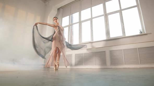 Modern Ballet Dancer in Scenic Flowing Costume Working Out at Studio, Slow Motion