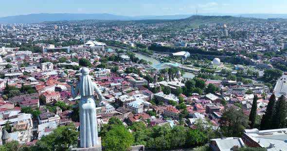Tbilisi, Georgia - June 12 2022: Aerial view from drone to Monument Mother of Georgia (Kartlis Deda) alt
