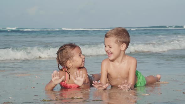 Two Kids Swimming in the Sea alt