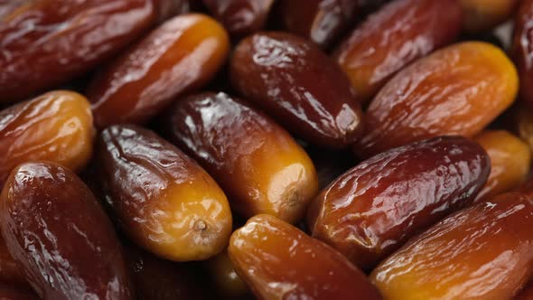 Fresh dates fruits close up, rotation. Eating dried fruits. Vegan, vegetarian food. 4K UHD video alt