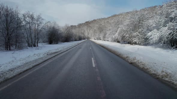 Aerial View of Plateau LagoNaki Mountain Twisted Road in the Winter and Driving Car alt