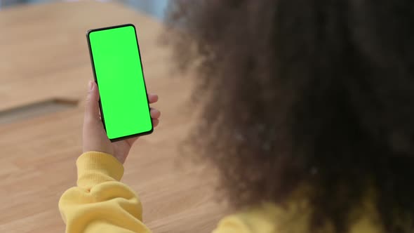 African Businesswoman Using Smartphone with Green Chroma Key Screen alt