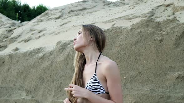 Sexy Fit Seductive Woman in Bikini Relaxing Sunbathing Alone at Sandy Beach