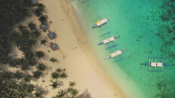 Top Down Aerial of Sand Beach with Boats at Ocean Coast. Vessels with Tourist at Turquiose Water alt