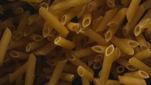 Pasta Penne Is Tossed In The Air In Slow Motion alt