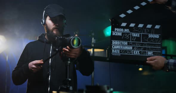 Film Crew Shooting Take of Scene in Studio alt