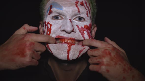 Clown Halloween Man Portrait. Creepy, Evil Clowns Blood Face. White Face Makeup alt