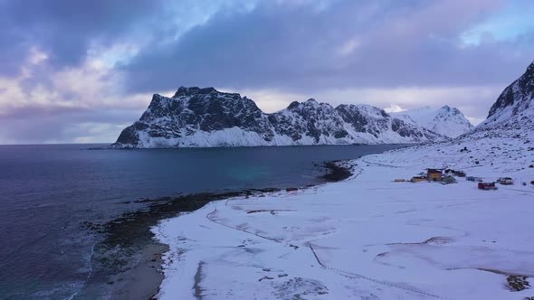 Uttakleiv Beach and Mountains in Winter. Lofoten Islands, Norway. Aerial View alt