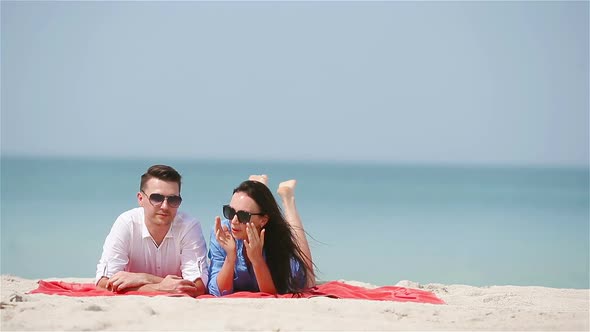 Young Family of Two on White Beach During Summer Vacation alt