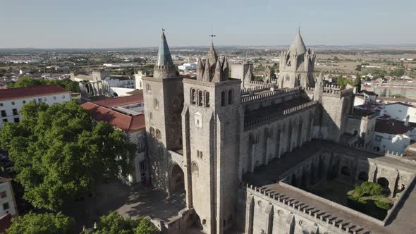 Ancient Cathedral of Evora and surrounding landscape, Portugal. Aerial circling