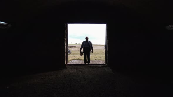 Desperate farmer near an empty barn.  World economic crisis alt