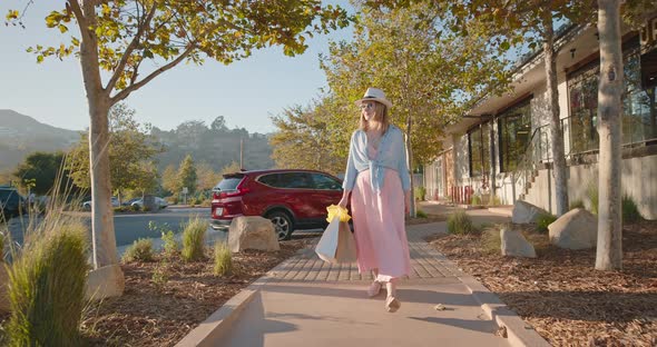  Slow Motion Independent Female Shops at Retail Stores in the Shopping Village alt