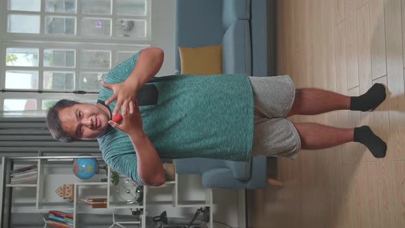 Asian Man Blogger Shoots Video Content For Social Networks, Magician With Red Ball alt