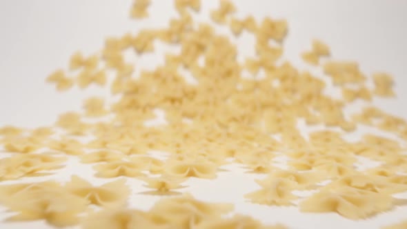 Stream Of Farfalle Pasta Moving To A Camera