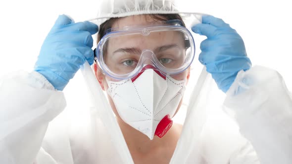 Closeup of Exhausted and Tired Face of Female Doctor Looking in Camera Against White Background alt