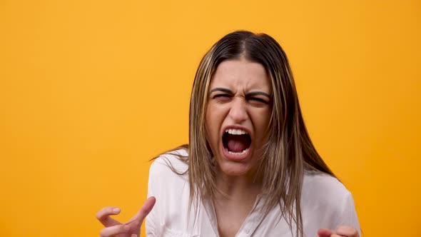 Portrait of Angry and Unhappy Woman Screaming at the Camera alt