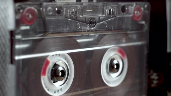 vintage audio cassette fast forwarding and then playback in tape deck alt