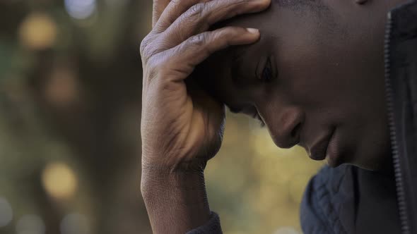 desperate worried young black african man. Worries,troubles alt