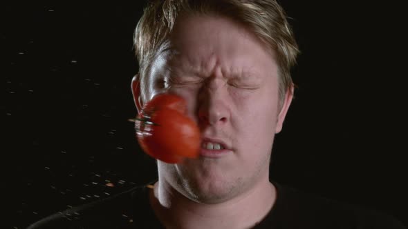 Slow Motion Shot Of Tomato Hitting Man In Face Shot On Phantom Flex At 2000 Fps Stock Footage 5801