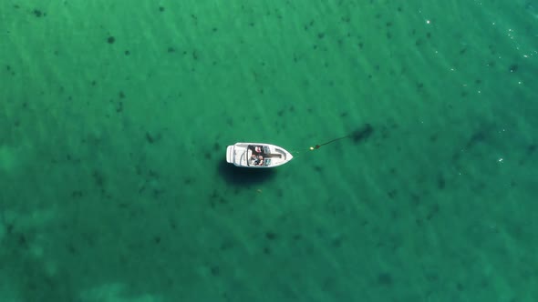 Aerial View of a Fisher on a White Drifting Boat alt