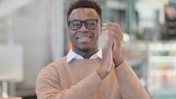 Portrait Shot of Happy Creative African Man Clapping Applauding alt