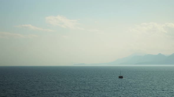 Sailing boat floating in sea alt