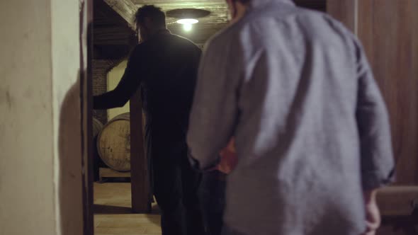 Senior couple entering a wine cellar