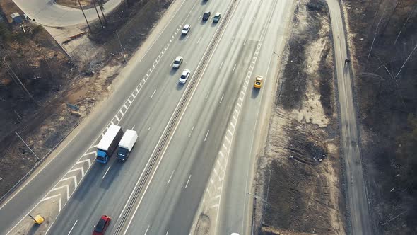 A Bird'seye View of a Country Road Cars are Going Fast alt