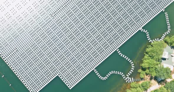 Aerial Top View of Electric Power Industry Solar Panels on Floating in Lake Water Renewable Energy alt