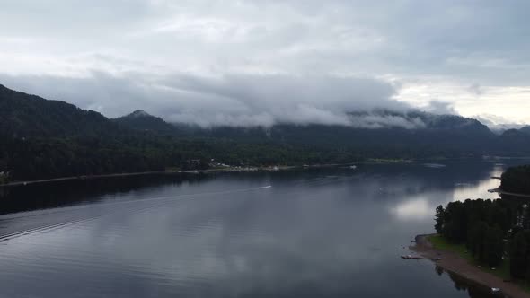 morning lake with forest in Altai