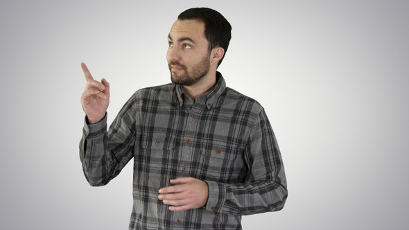 Handsome young man walking and looking to the camera and alt