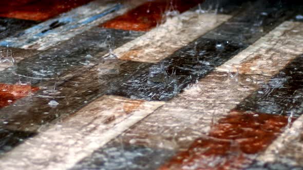 Rain Drops On Colorful Wooden Ground