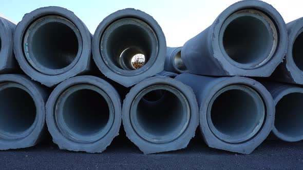 Motion Along Concrete Pipes to Install at Construction Site alt
