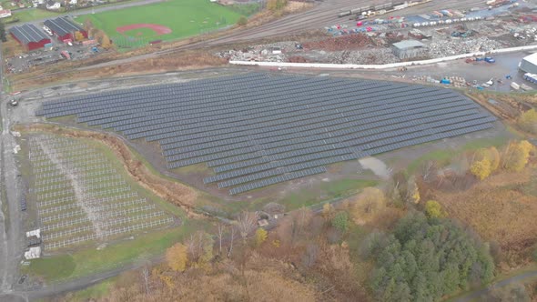 Solar Panel Field in Industrial Area Clean Energy Concept Aerial Establishing