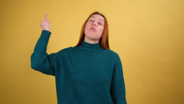 Young Red Hair Woman Posing Isolated on Yellow Color Background Studio alt